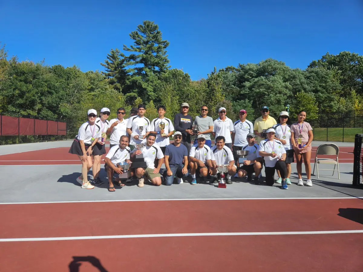 UDTA tournament players and volunteers pose with their trophies on the courts after the 2025 UDTA Tournament.